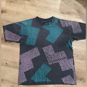 Vintage 90’s Reebok Step T-Shirt in Black and Teal. Approximately XL
